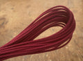 Hank of deep maroon three-strand hard-laid cotton cordage handmade by Blood Knot